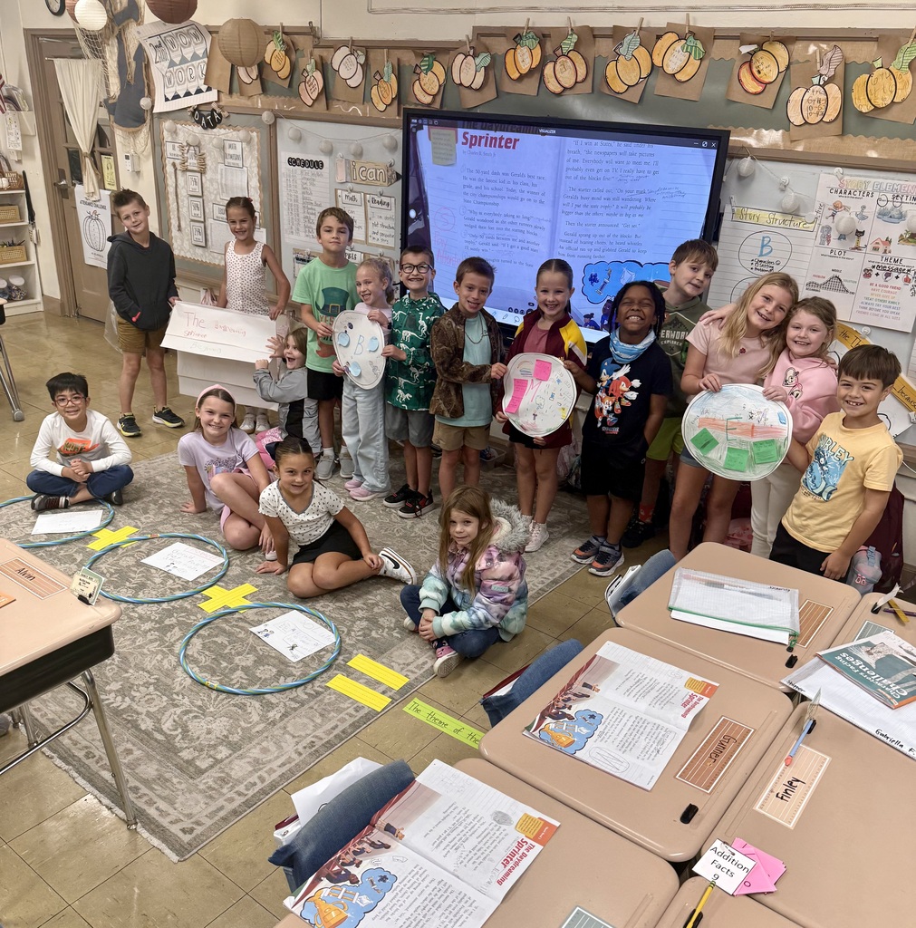 group of students posing for a group picture in a classroom