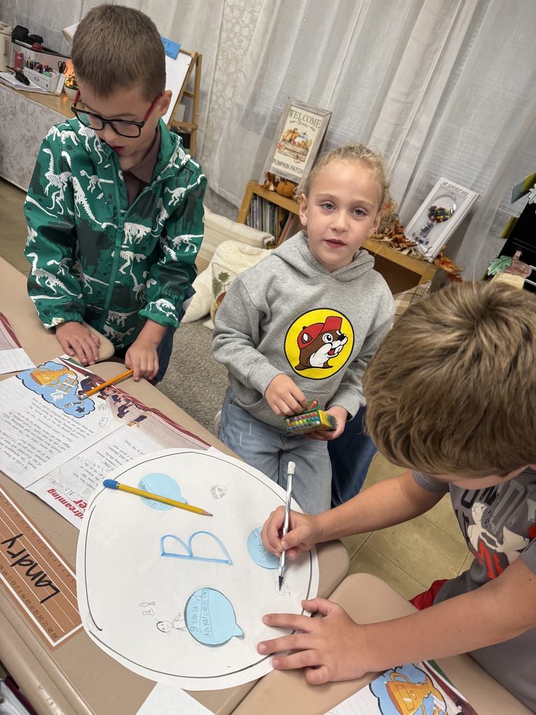 students writing on paper as a group