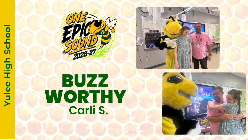 A YHS student receiving the Buzz Worthy certificate