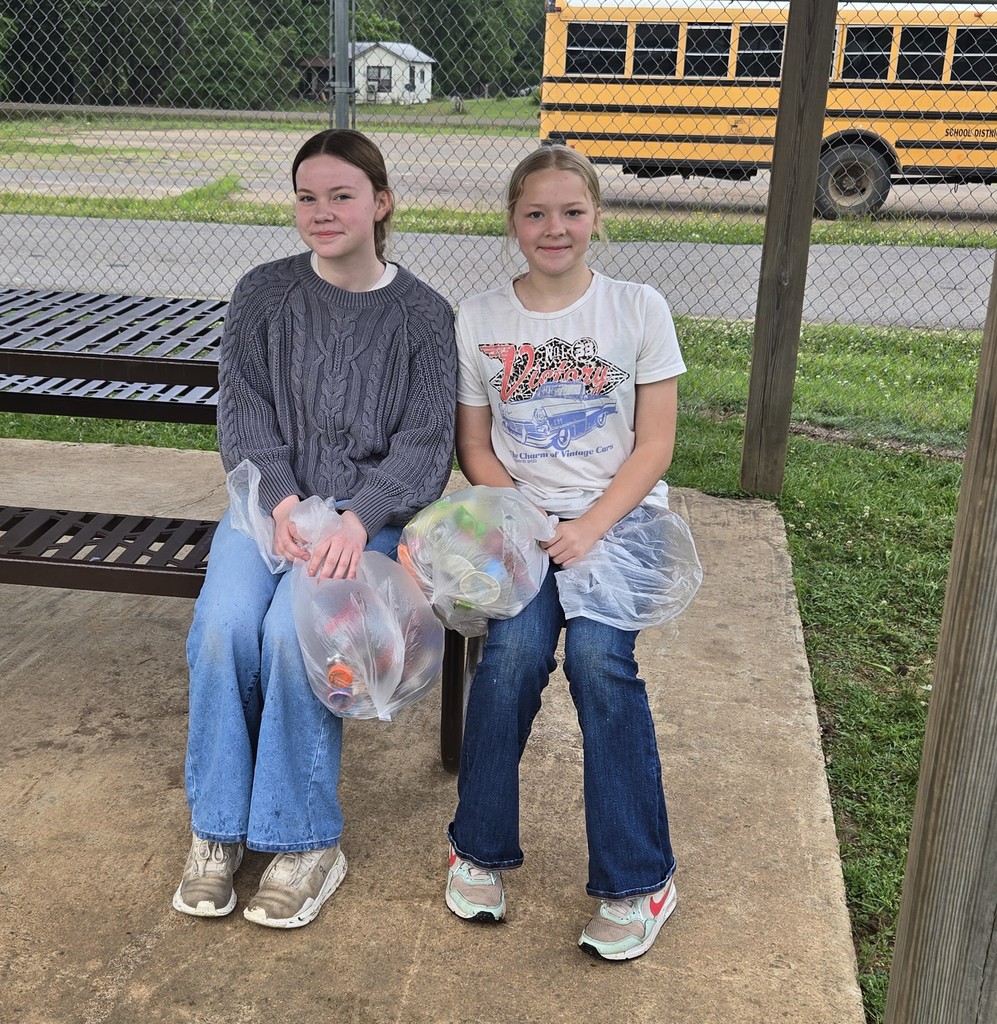 Children holding trash bags