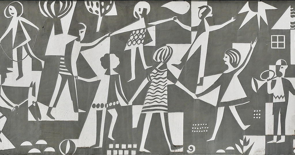 grey and white image of children playing