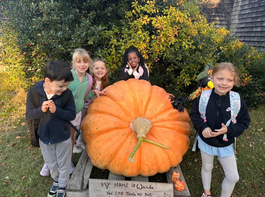 kids with giant pumpkin