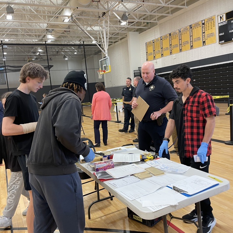 students processing crime scene