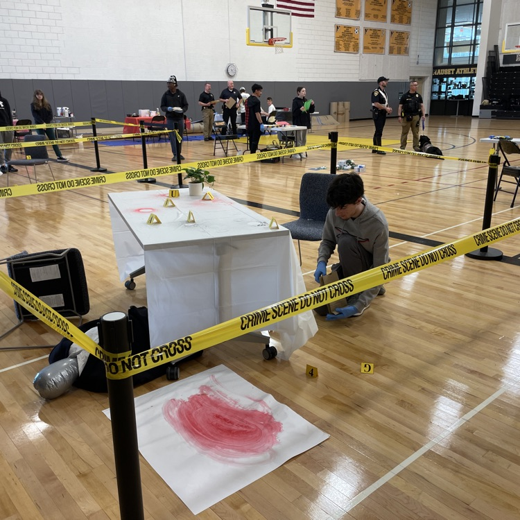students processing crime scene