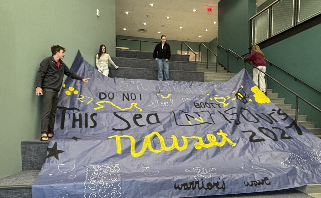 Junior Class Pep Rally Banner on blue paper with black and gold lettering - "Do not steal the Juniors Booty. This sea is ours. Nauset 2027, warriors wave"
