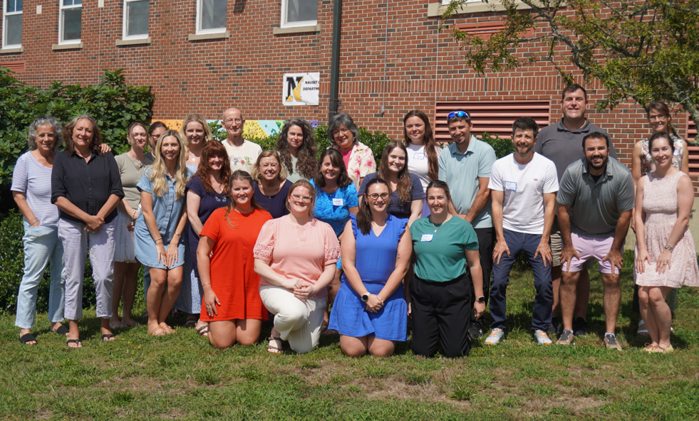 nauset staff pose outside