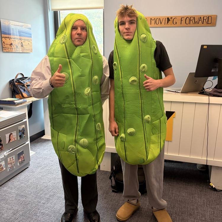 Principal Clark and a student in pickle costumes