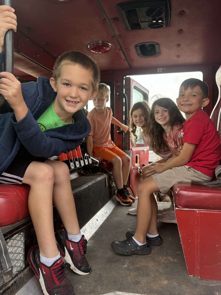 Fire fighters visit navajo students.