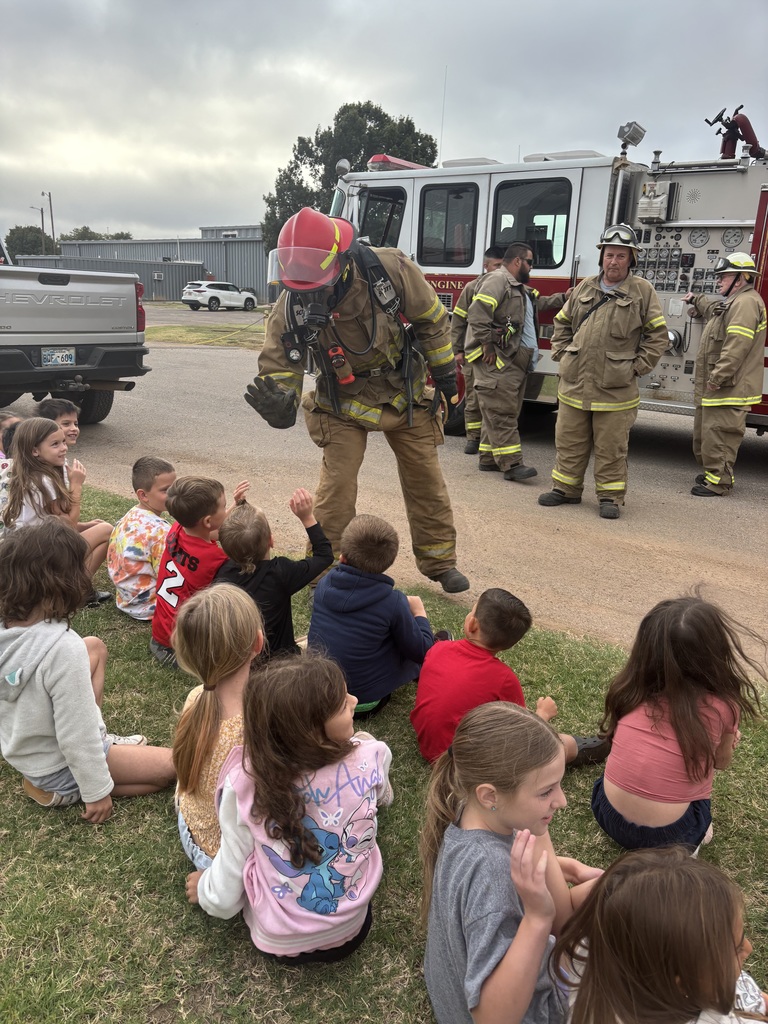 Fire fighters visit navajo students.