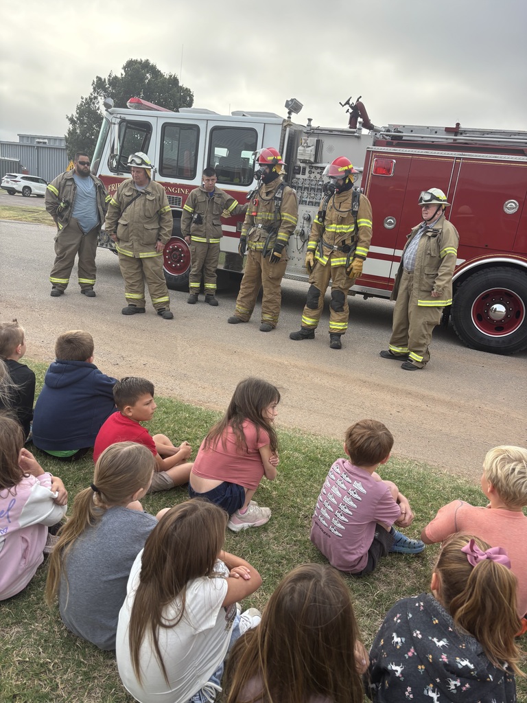 Fire fighters visit navajo students.