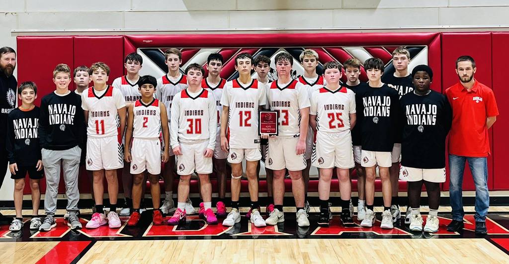jr high boys team lined up in two rows on the court