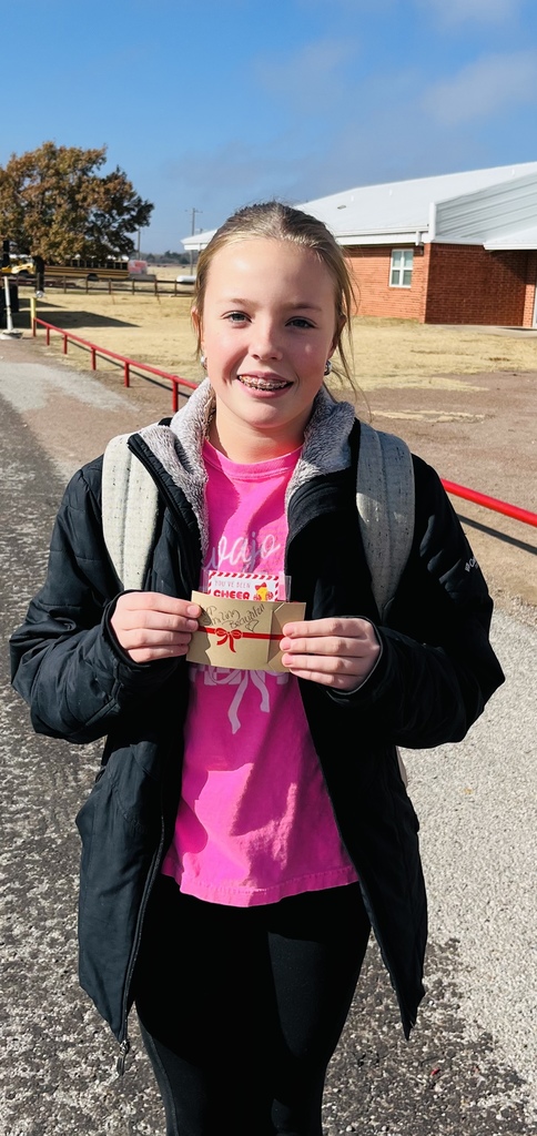Emmy Lou holding a certificate