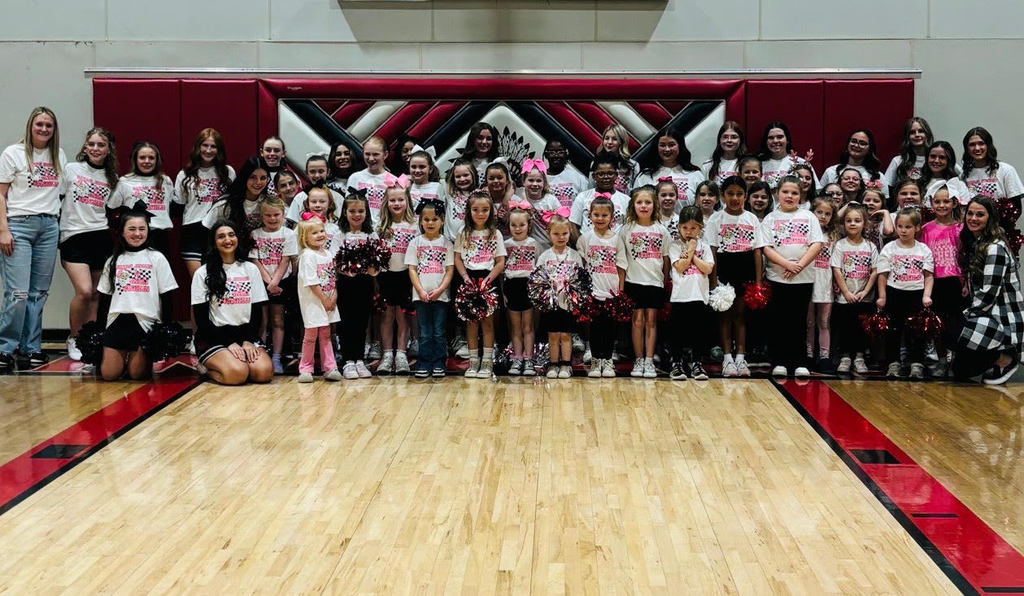 All students who joined the Pep Squeakers lined up on the basketball court with the JH/HS cheer leaders and coaches.