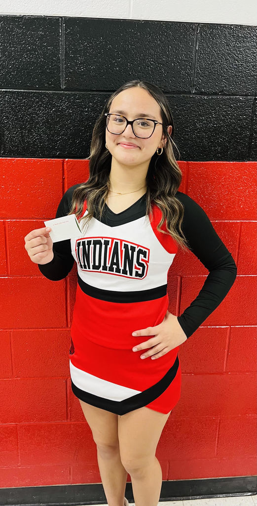 Cheerleader of the week holding a cerificate