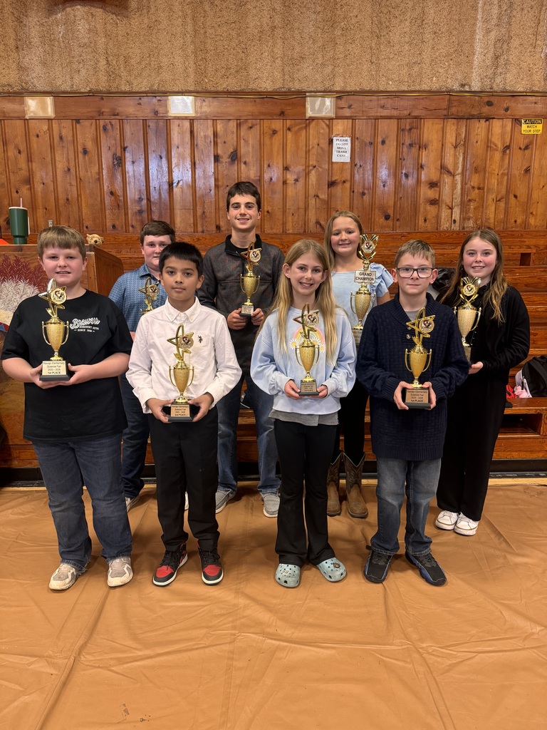 Science fair winners holding their trophy's