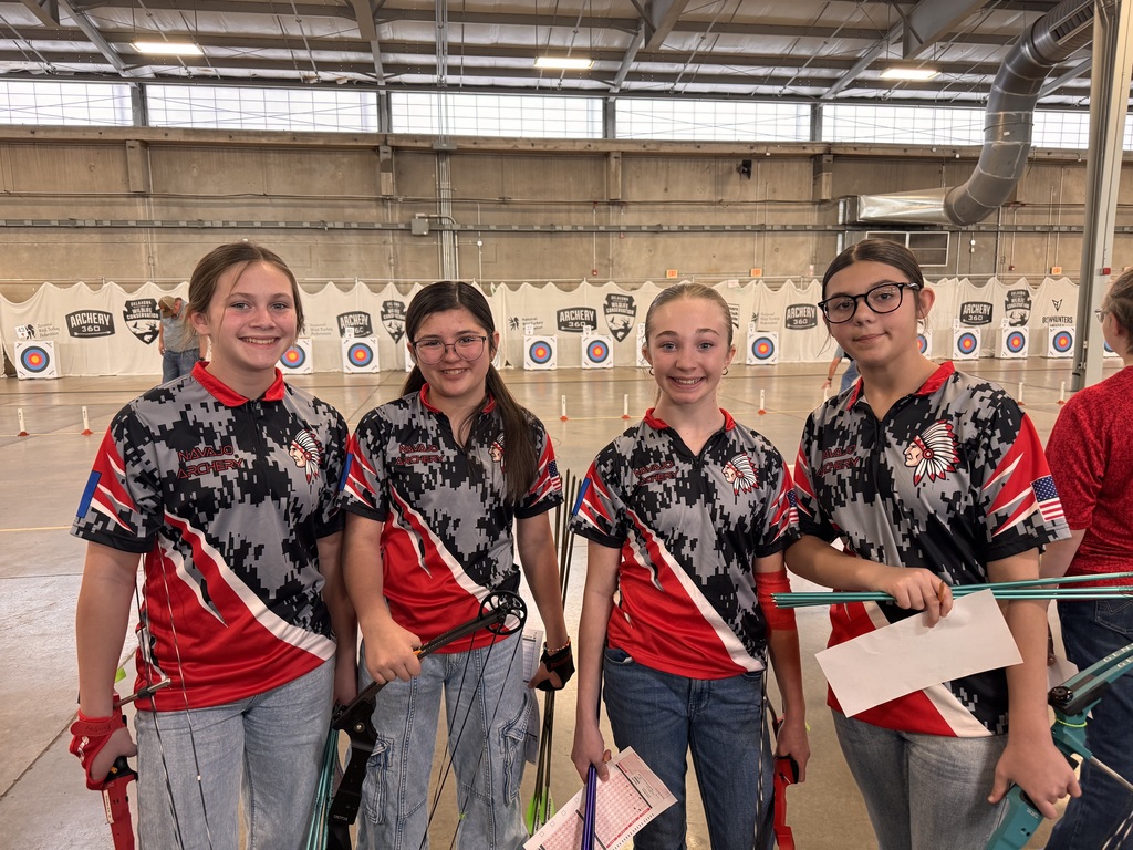 4 archery girls waiting for their turn to shoot