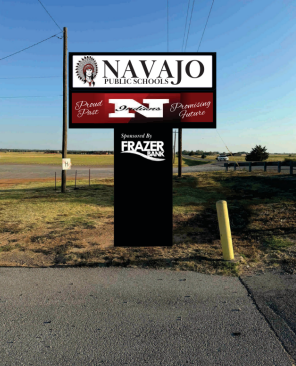 A photo showing Navajos future digital message board out in from of the school.