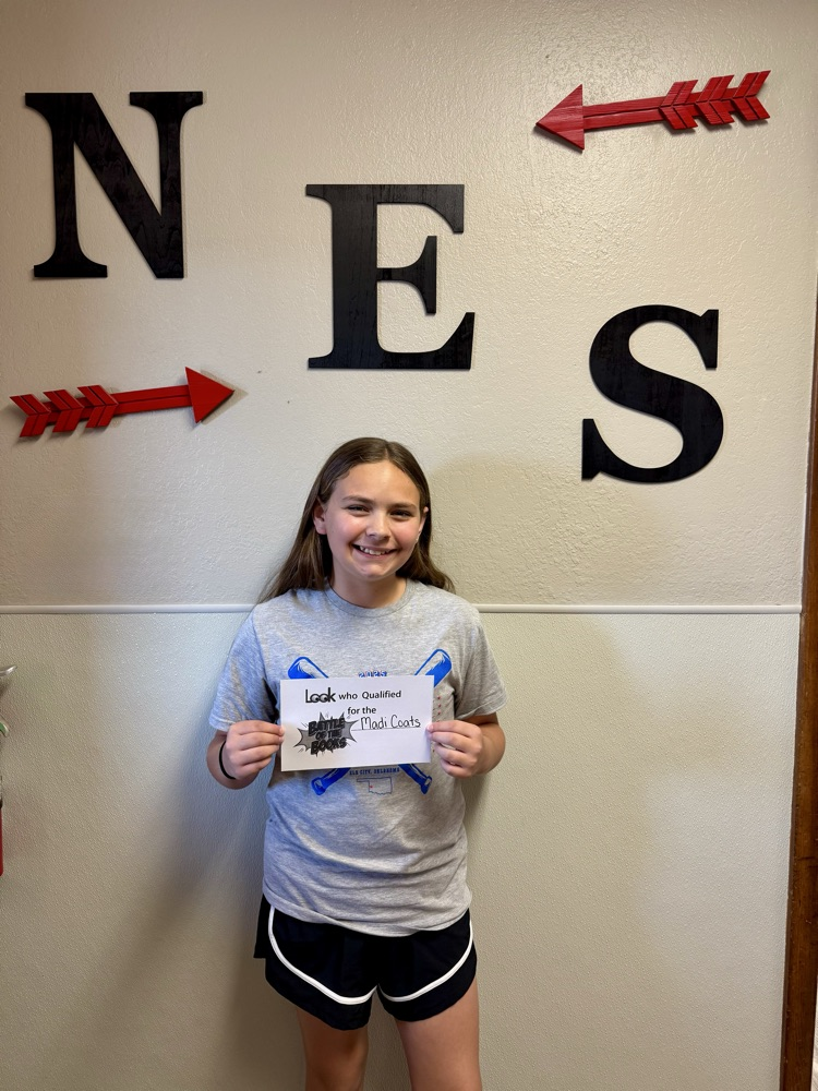 student standing with certificate