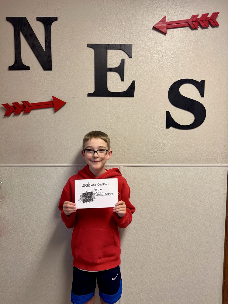 student standing with certificate