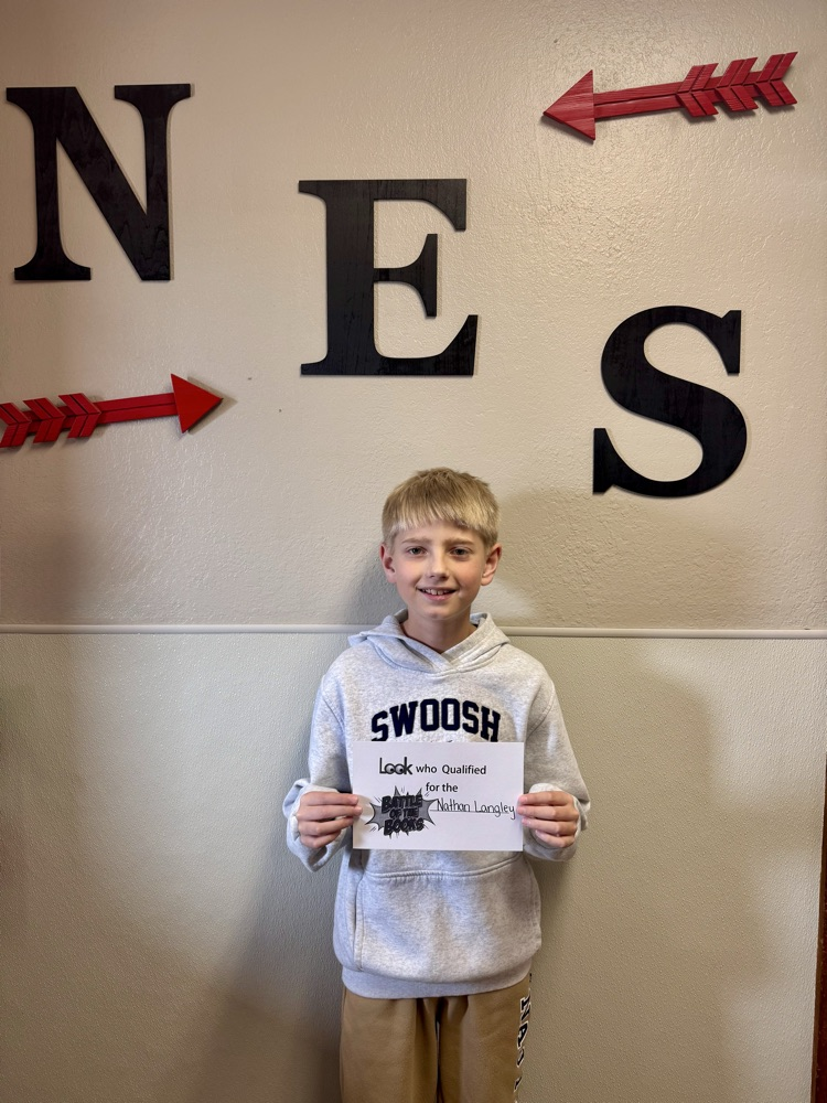 student standing with certificate