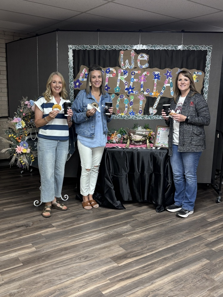 teachers standing at coffee bar