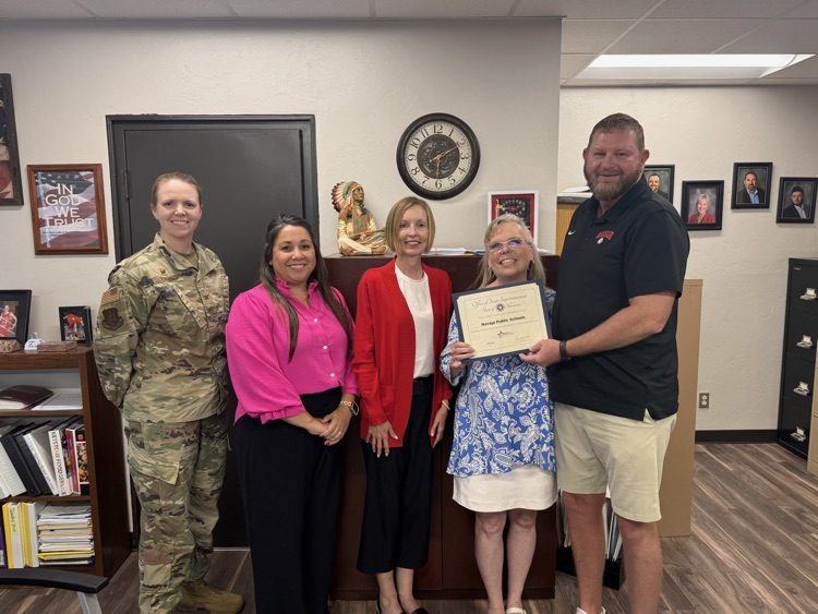 superintendent and principal receiving award with ALTUS Air Force Base members