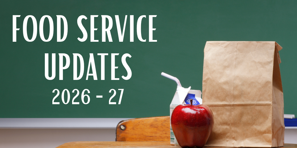 chalkboard background with bagged school lunch, apple & milk in a carton