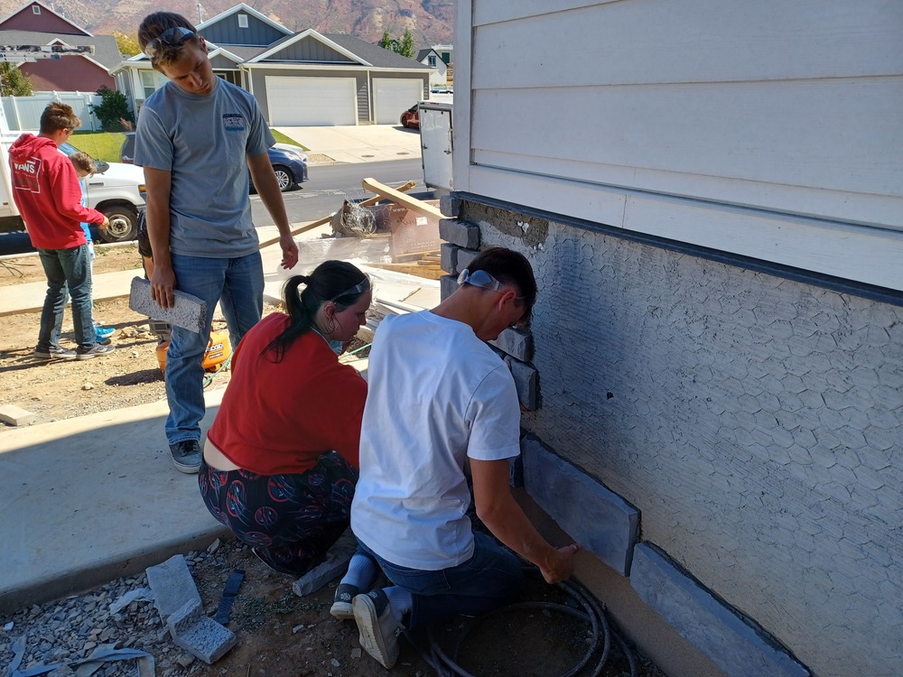 students finishing concrete