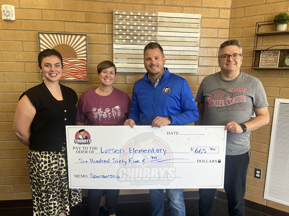 PTA people accepting a check from business