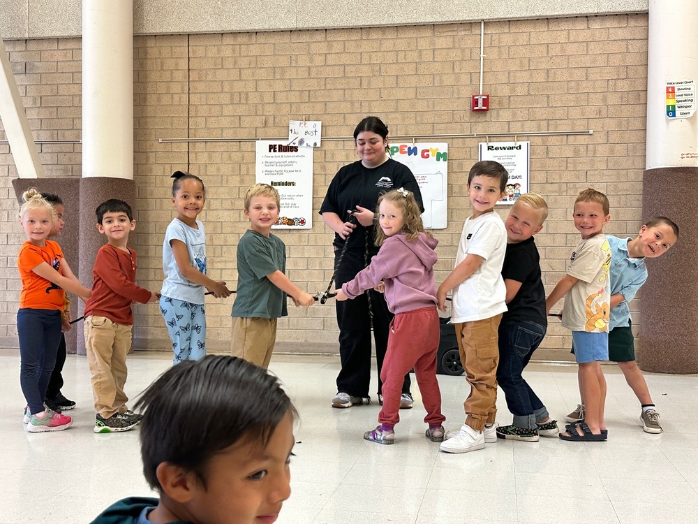 Kids at school playing a rope game