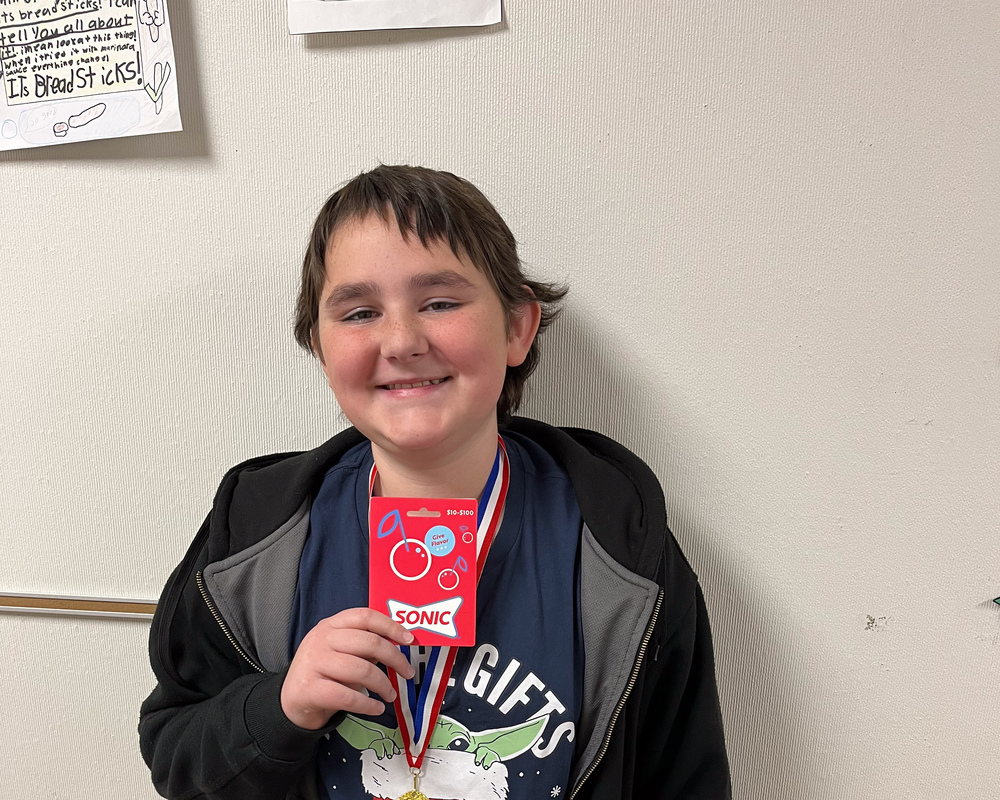boy with math medal