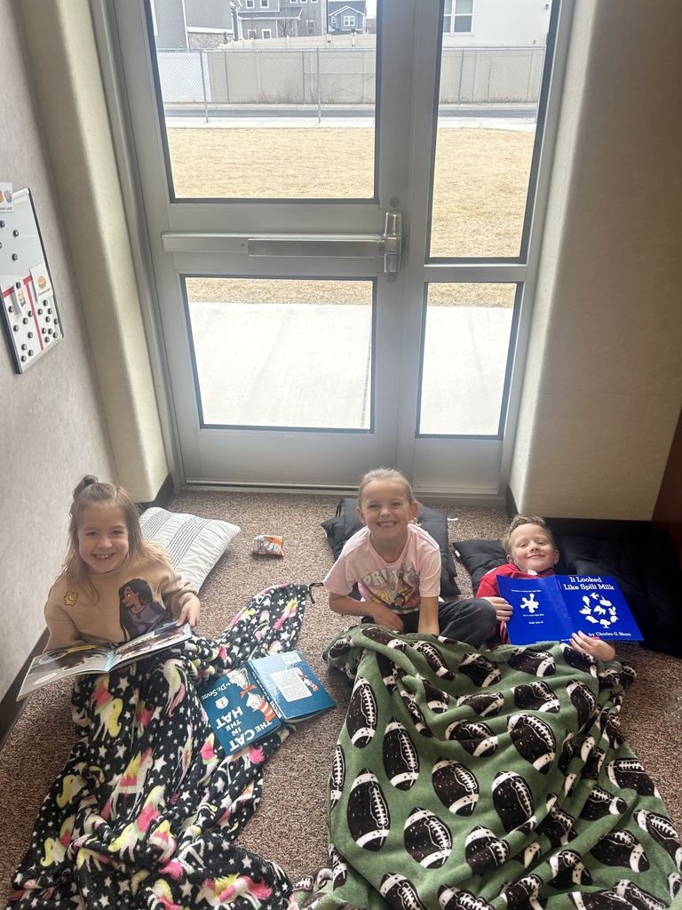 students reading on the floor