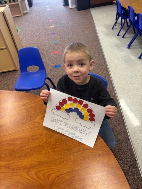 Student showing off their coloring