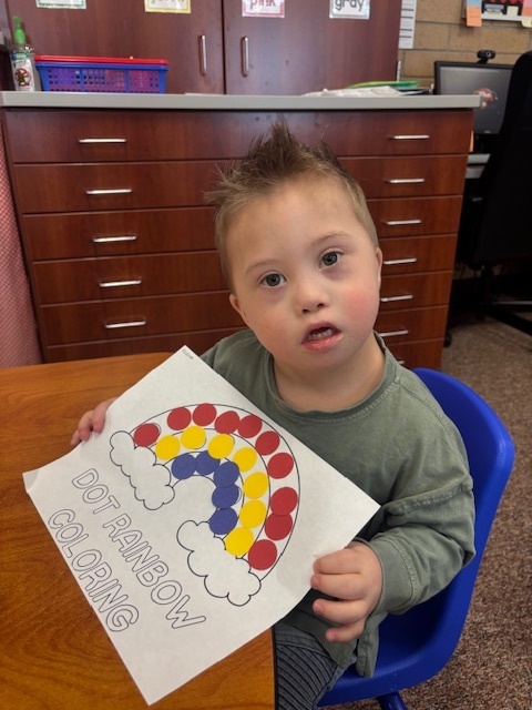 Students showing off their coloring