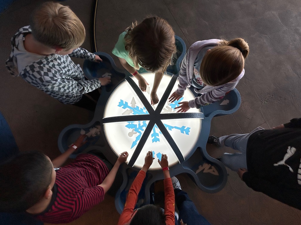 students playing with light and shapes