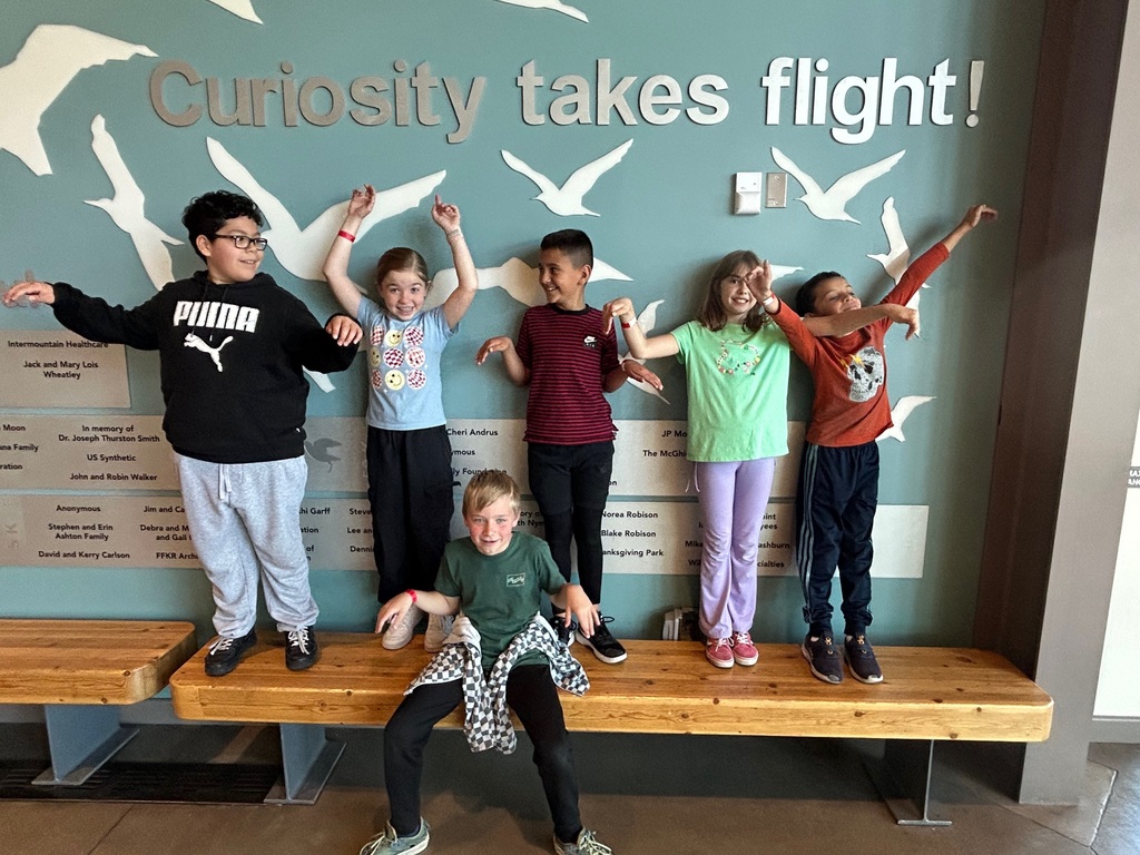 students posing with 'wings'
