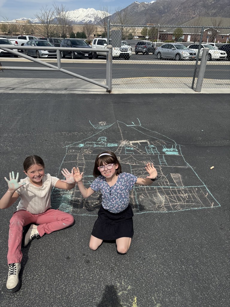 Student posing with chalk art