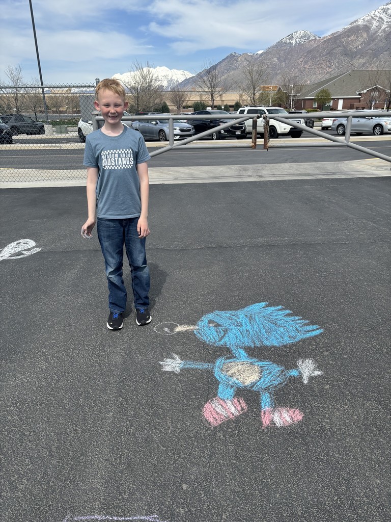 Student posing with chalk art