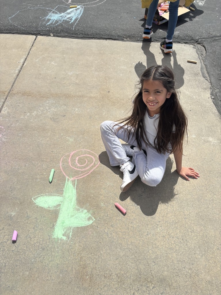 Student posing with chalk art