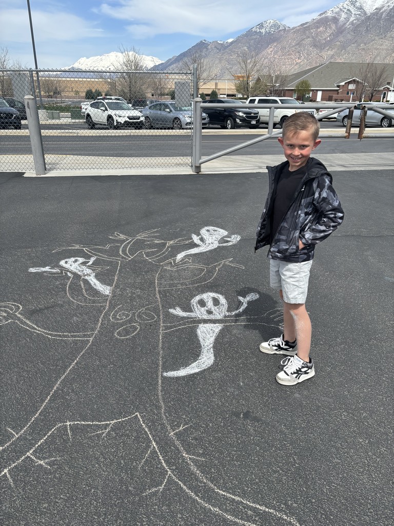 Student posing with chalk art