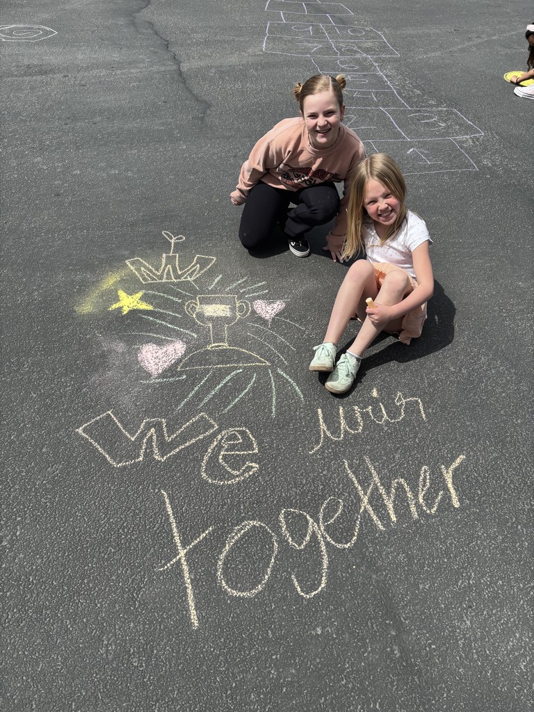 Student posing with chalk art