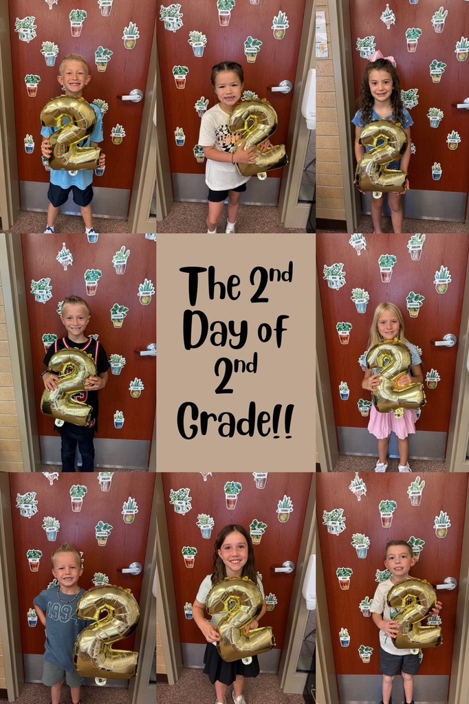 2nd graders holding a number 2 balloon.