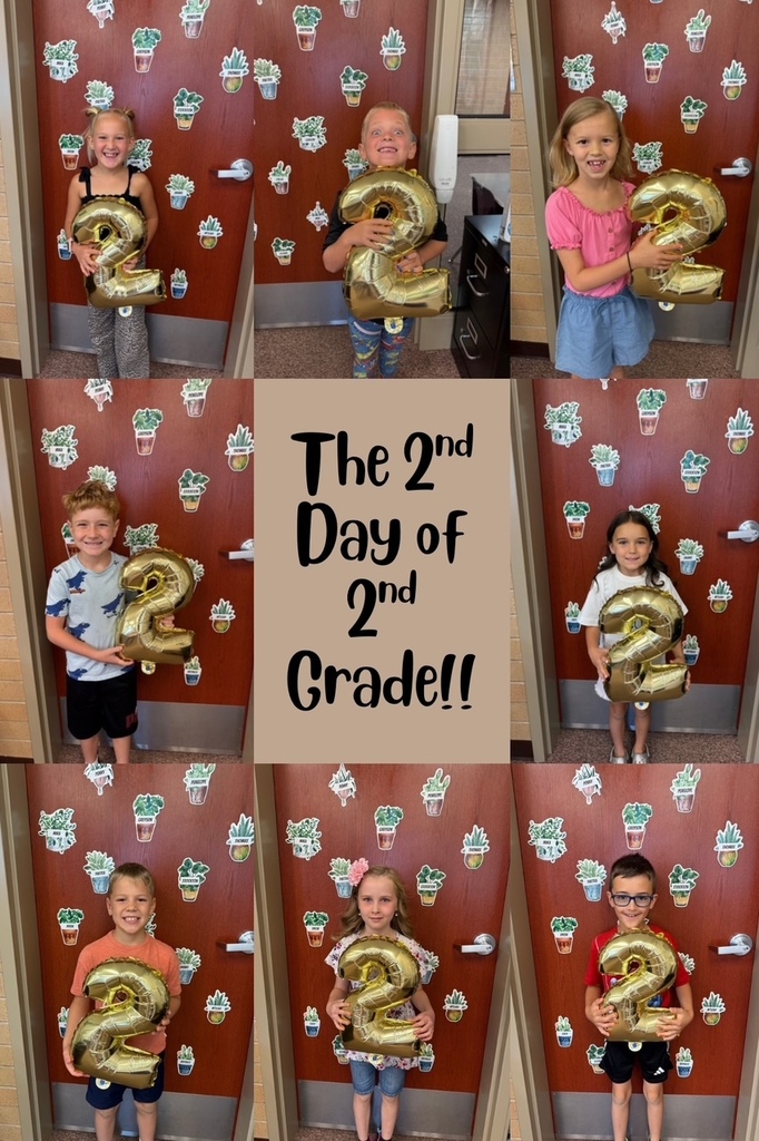 2nd graders holding a number 2 balloon.
