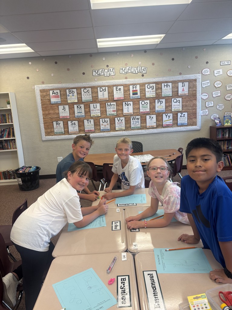 4th graders participating in an activity.