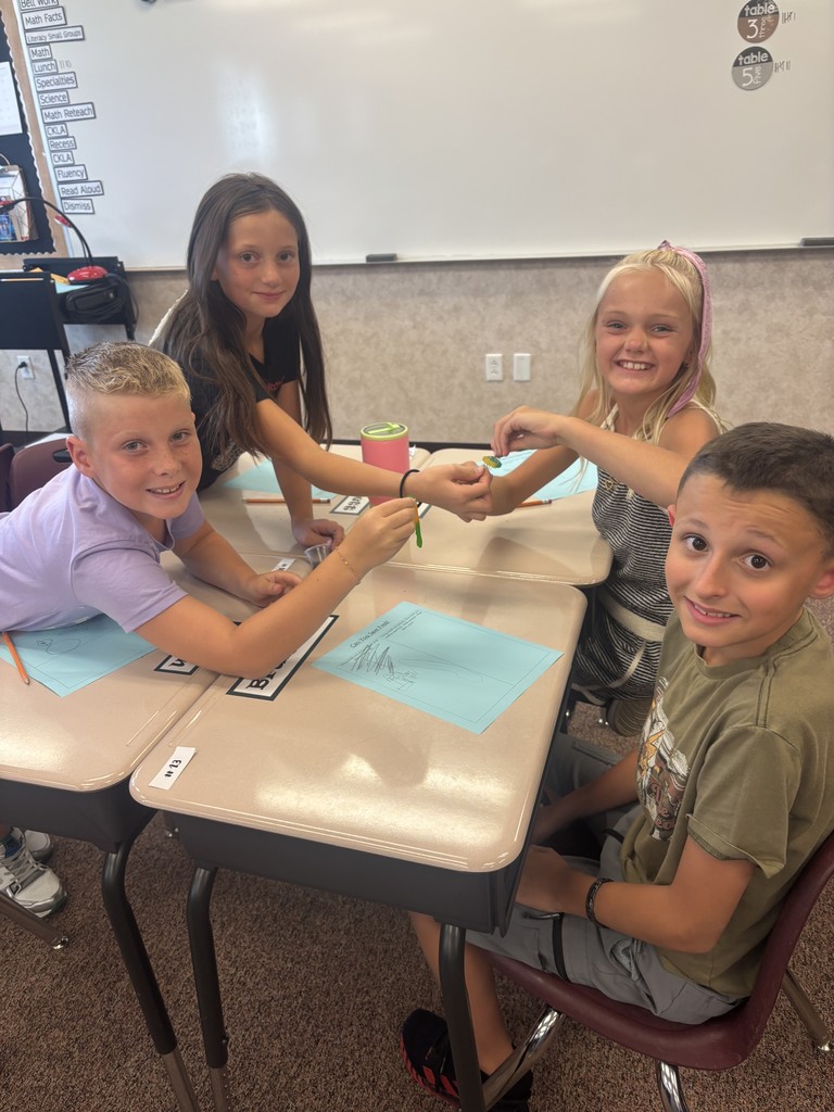4th graders participating in an activity.