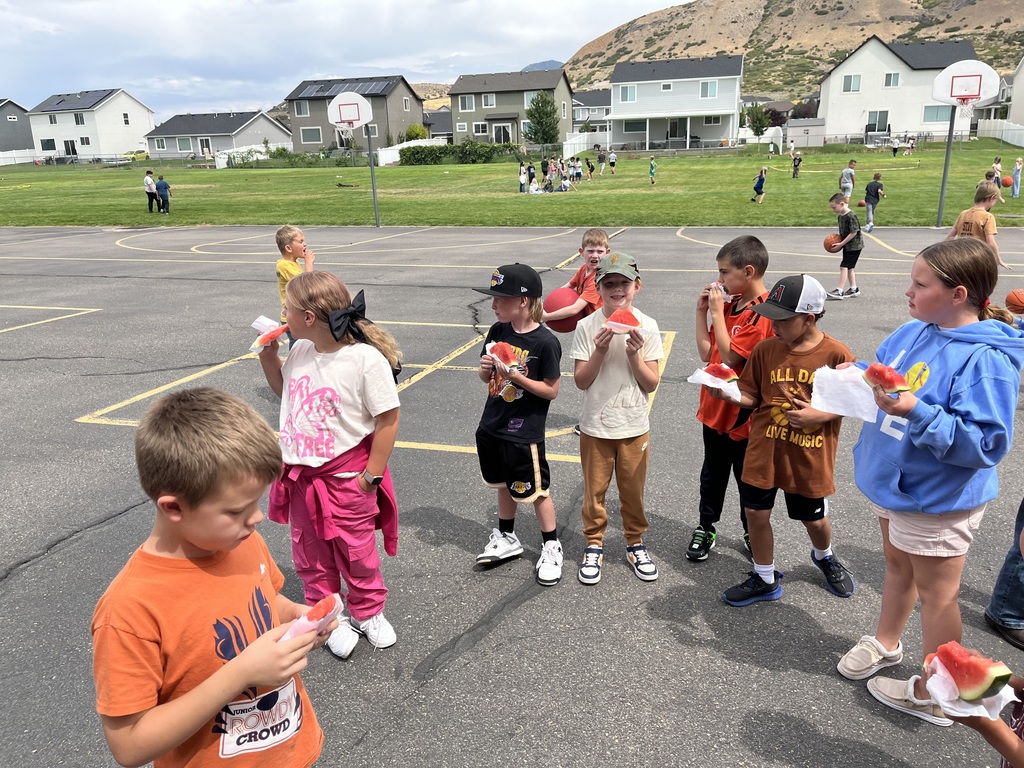 kids eating a slice of watermelon