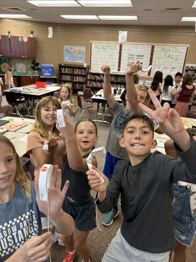 fourth graders with their 'robot fingers'