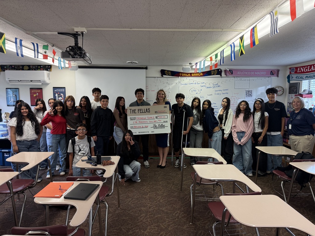 Students with teacher who received $500 from the Fellas Barbershop