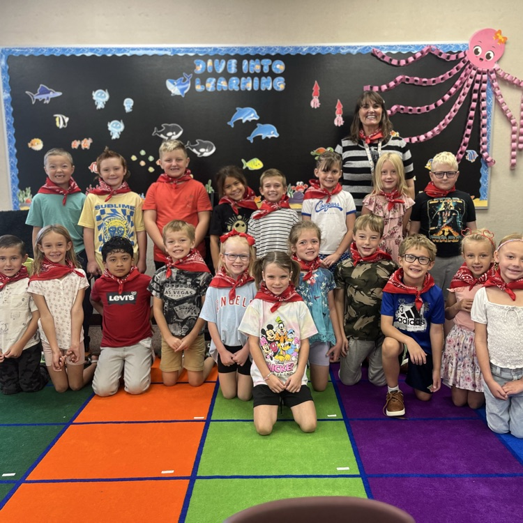 Mrs Braden and her students with red bandannas around their necks