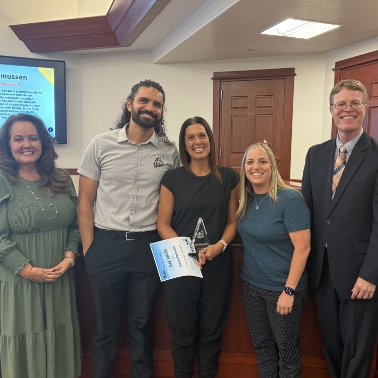 Brooke Rasmussen, receives the PEAK Award at the Nebo School District Board Meeting